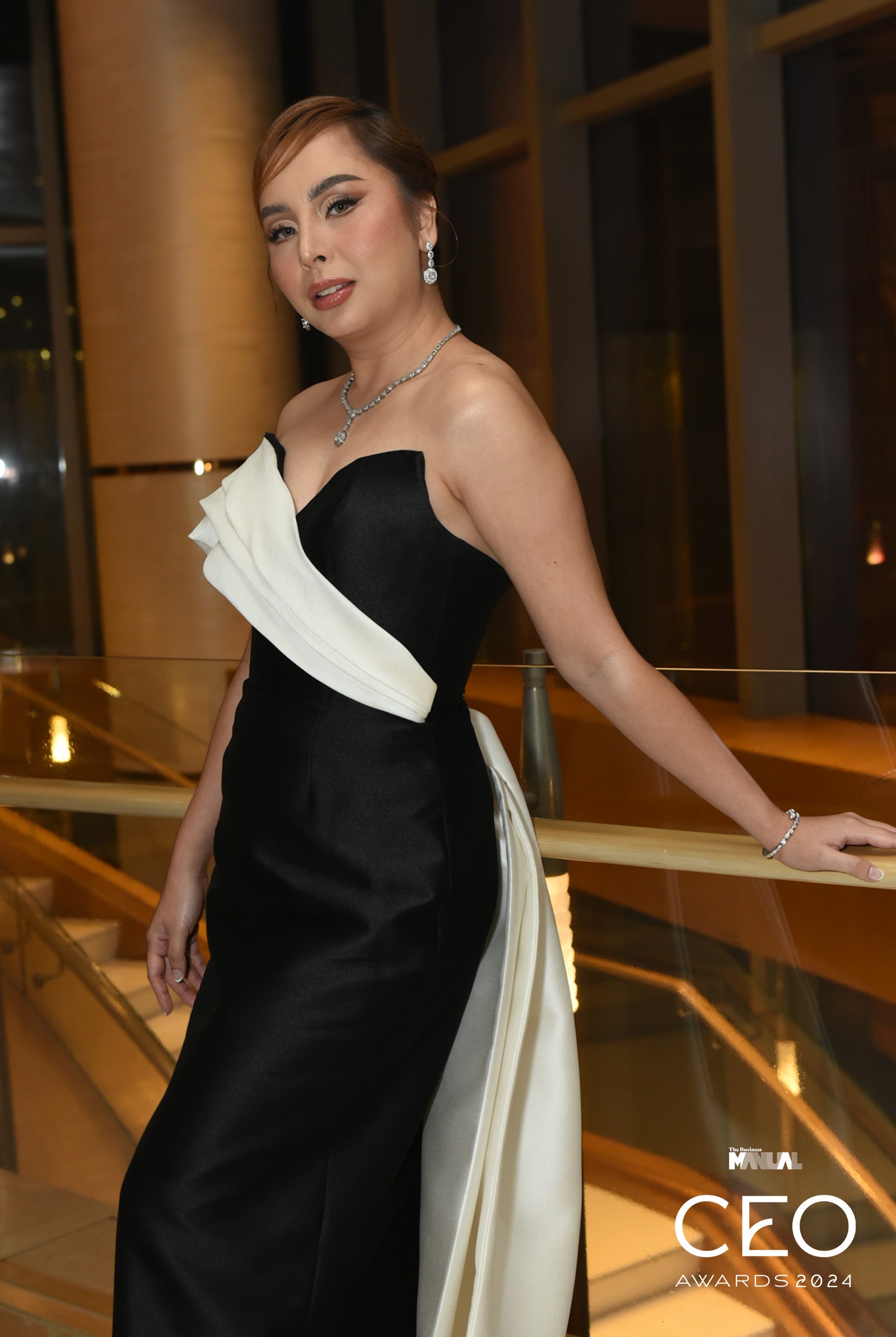 Dear Face CEO Jonah Sison-Ramos donning a black and white gown at the The Business Manual CEO awards